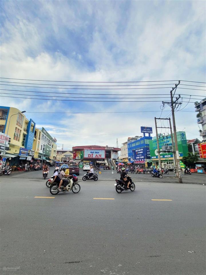 Bán nhà mặt tiền kinh doanh ngay chợ dĩ an 1. dt 120,5m2 (6x20m) thổ cư 100%. giá 13,99 tỷ tl.