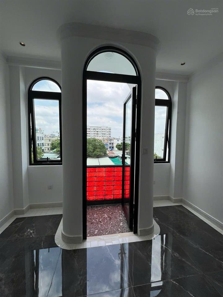 Nhà mặt tiền hẻm xe tải, có thang máy, 04 tầng, hoàn công đầy đủ, có sổ hồng, thông đường t.q.khải