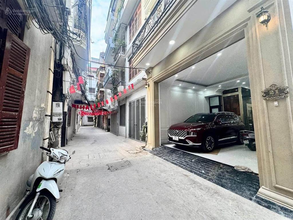 Hoàng văn thái 23,5 tỷ mặt tiền 6,7m gara 2 ô tô 6 tầng thang máy