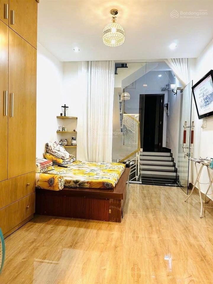 Bán nhà mới 4 tầng  hẻm oto phan đăng lưu thông phan xích long