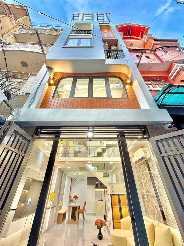 Nhà nở hậu 5 tầng cao cấp  sát mặt tiền hoàng văn thụ.  anh út  0908 120 ***