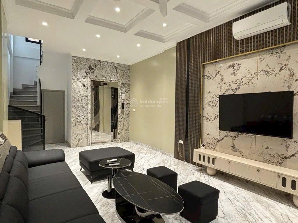 7 tầng thang máy  trần quốc vượng  cầu giấy  15m ra ô tô  ngõ thông  sổ đỏ 39m2 x 7 tầng 10 tỷ