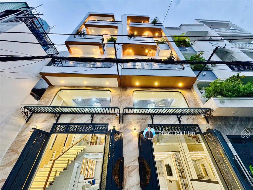 Nhà mới ngay an dương vương, 60m2, 5 tầng đúc, 4pn hẻm rộng 8m, gần cv phú lâm, tiện kinh doanh