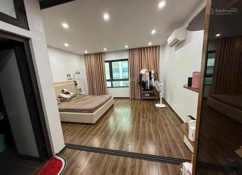 Bán nhà hồ tùng mậu 45m  8t  gara  ngõ thông kd  vài mét ra phố  giá cực êm