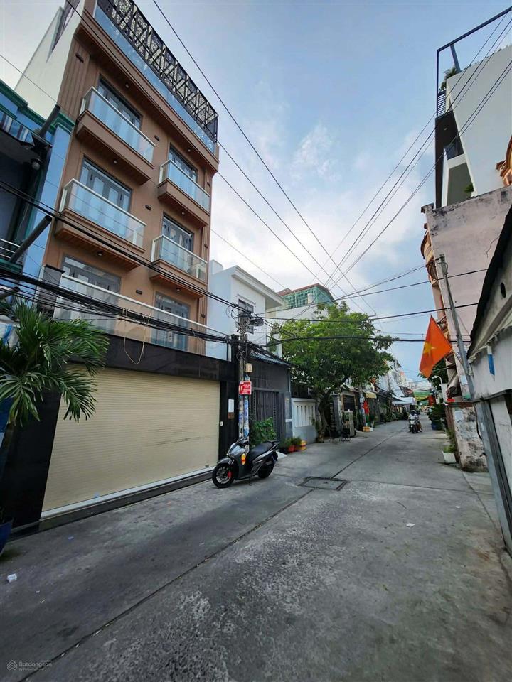 Bình tân.lê văn quới.5 tầng 60m 6pn. lớn 2 ô tô ngủ trong nhà. đường thông . giá 8 ty nhỷn