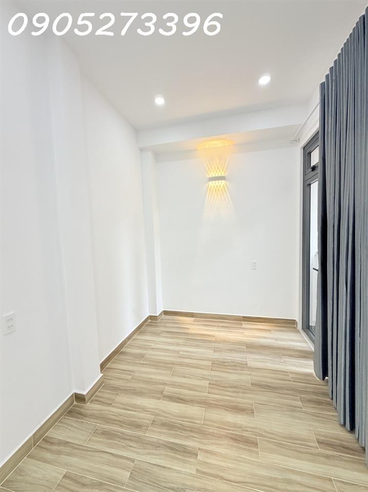 NHÀ MỚI ĐẸP CẠNH MẶT TIỀN TRUNG TÂM TÂN BÌNH, 2 TẦNG KIÊN CỐ 2PN( 1 PN DƯỚI ĐẤT), SỔ