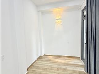 NHÀ MỚI ĐẸP CẠNH MẶT TIỀN TRUNG TÂM TÂN BÌNH, 2 TẦNG KIÊN CỐ 2PN( 1 PN DƯỚI ĐẤT), SỔ