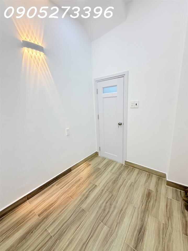 NHÀ MỚI ĐẸP CẠNH MẶT TIỀN TRUNG TÂM TÂN BÌNH, 2 TẦNG KIÊN CỐ 2PN( 1 PN DƯỚI ĐẤT), SỔ