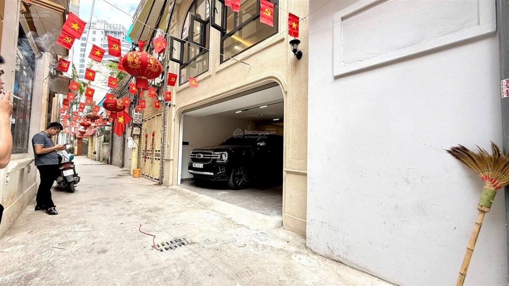 Gara ô tô 7c + vf3  6 tầng thang máy  sát ngoại giao đoàn  ngõ thông  mặt tiền khủng 5.7m