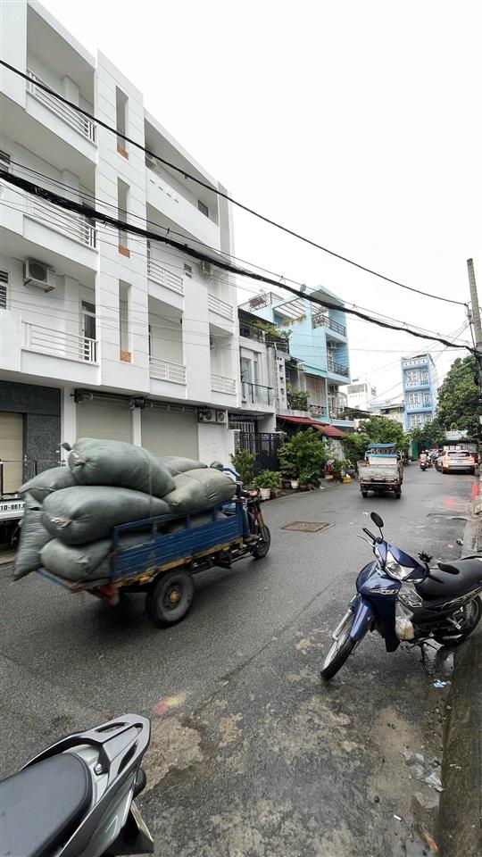 Nhà 1/ bình long, góc 2 mặt tiền hẻm thông kinh doanh 12m, dt 5m x 16m có thang máy đúc 5