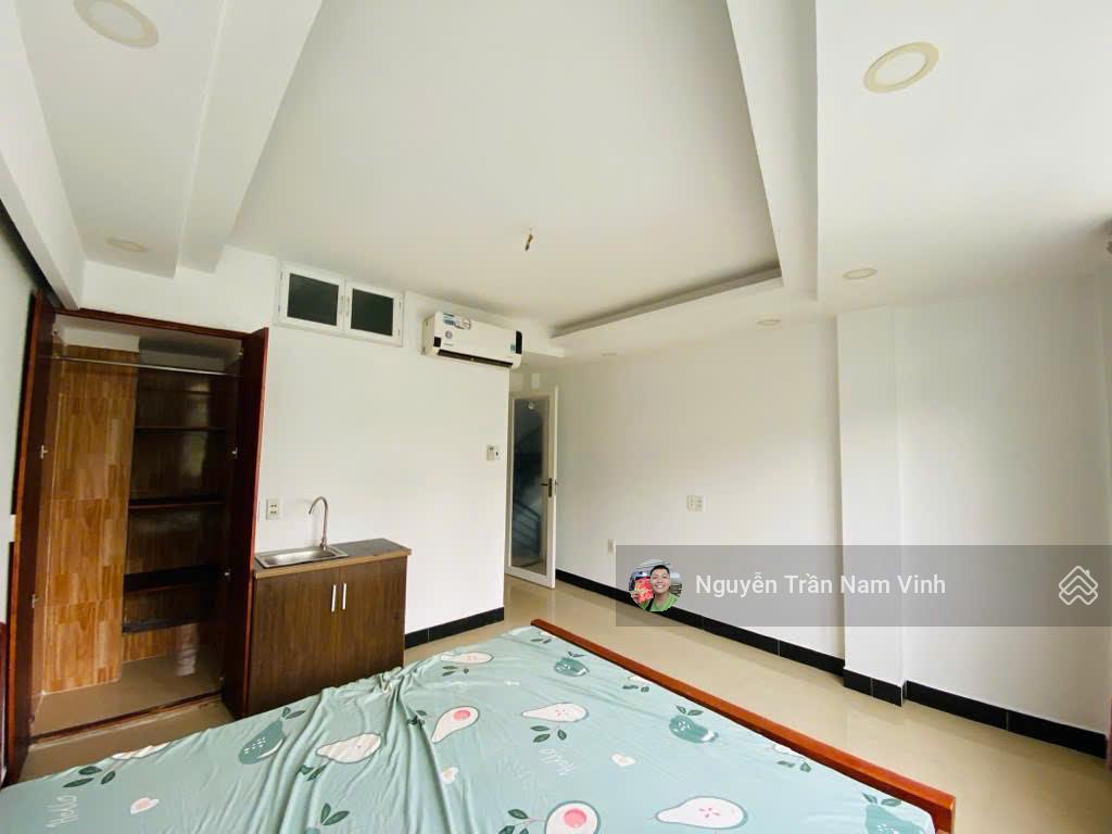 Bán nhà quận 7 đang làm căn hộ dịch vụ 8 phòng có gara để xe 5 tầng ngang 4.5m dài 13m chỉ 6,5 tỷ