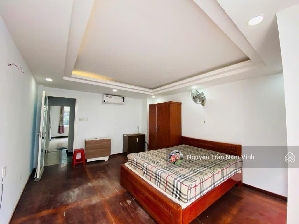 Bán nhà quận 7 đang làm căn hộ dịch vụ 8 phòng có gara để xe 5 tầng ngang 4.5m dài 13m chỉ 6,5 tỷ