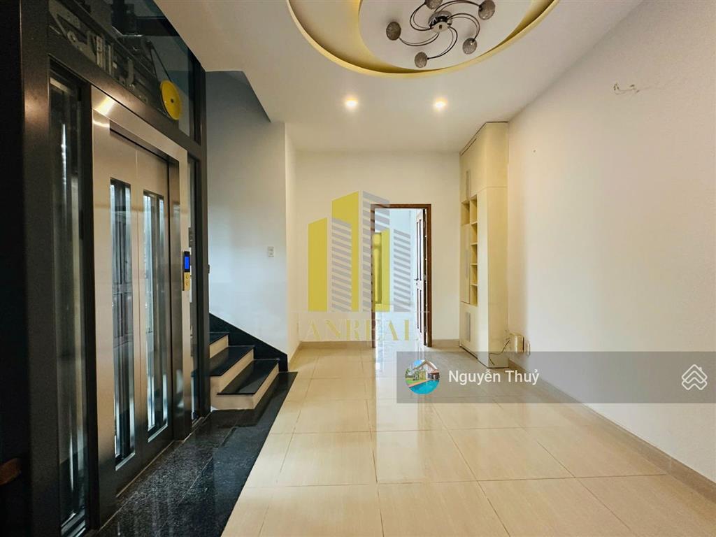 Nhà hầm trệt 1 lầu thang máy  6x23m giá 33 triệu  đường trần não