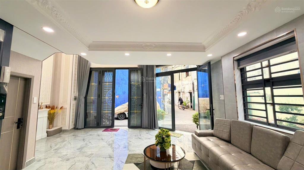 Bán nhà mới như hình góc 2mt đường quang trung, gò vấp. 7x7m, 5tầng có t.máy, hxh 5m, giá 7.7tỷ