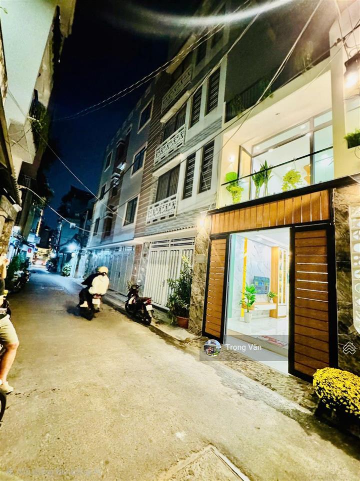 Nhà mới 2 mặt hẻm trước sau  sổ 54,5m²  hẻm xe hơi chạy thông. chỉ 9,8 tỷ