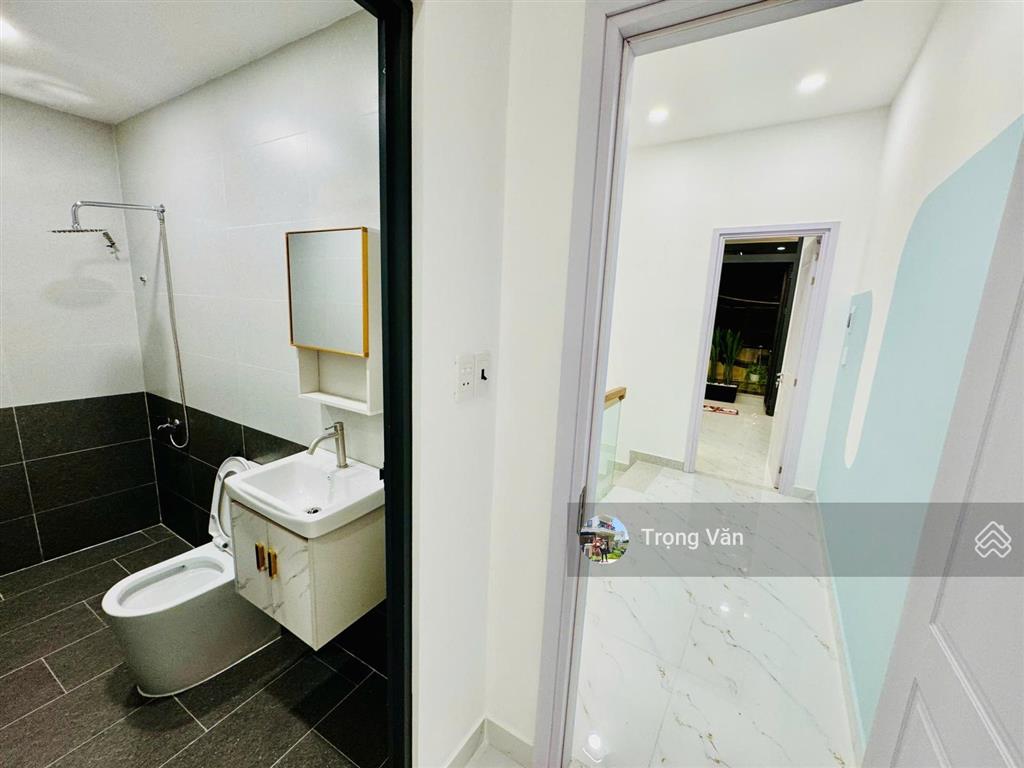 Nhà mới 2 mặt hẻm trước sau  sổ 54,5m²  hẻm xe hơi chạy thông. chỉ 9,8 tỷ