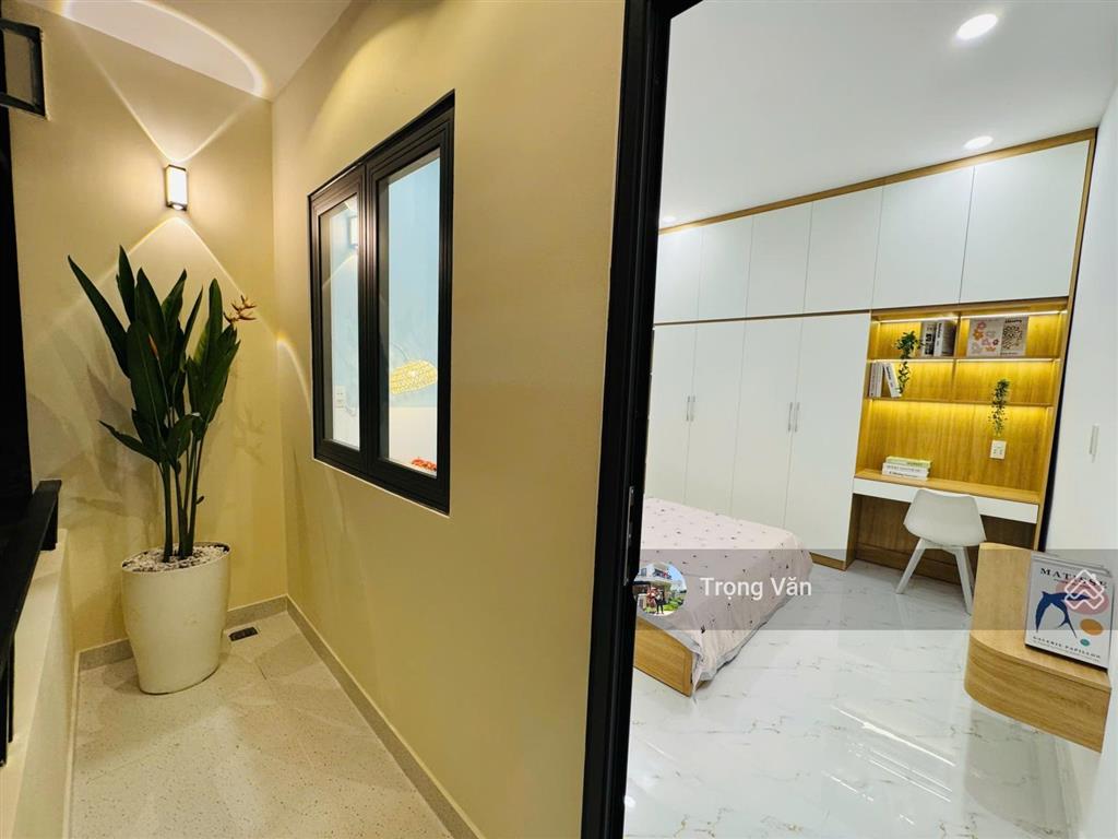 Nhà mới 2 mặt hẻm trước sau  sổ 54,5m²  hẻm xe hơi chạy thông. chỉ 9,8 tỷ