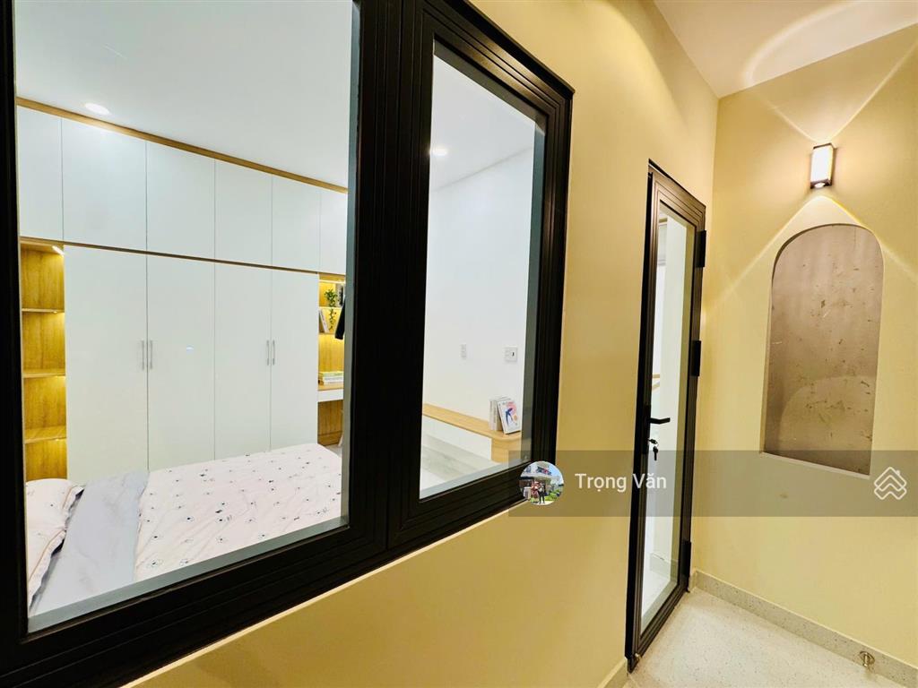 Nhà mới 2 mặt hẻm trước sau  sổ 54,5m²  hẻm xe hơi chạy thông. chỉ 9,8 tỷ