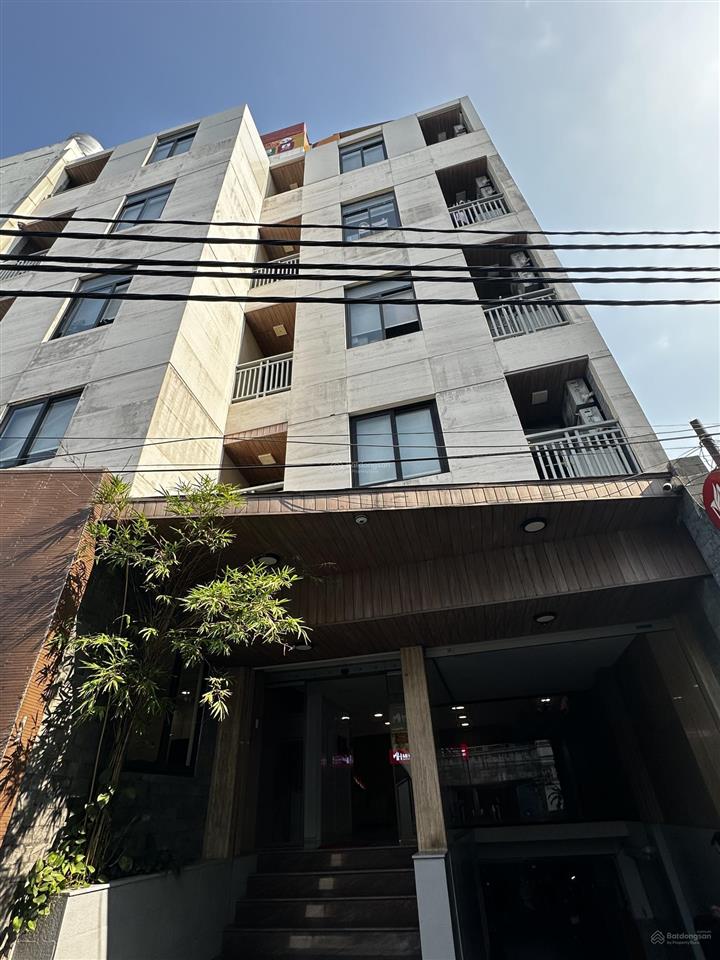 Bán tòa building ngay công viên gia địnhhồng hà, mt ngang 12m x 14m, 7 tầng, hđt 120tr, giá 36 tỷ