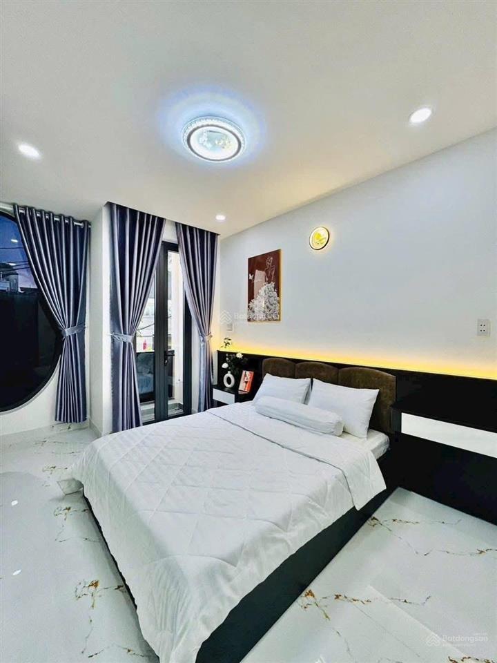 Hạ giá 200tr còn 2 tỷ250 triệu bán gấp nhà lê quang định bình thạnh, 2 pn,hẻm xe hơi, sổ hồng riêng
