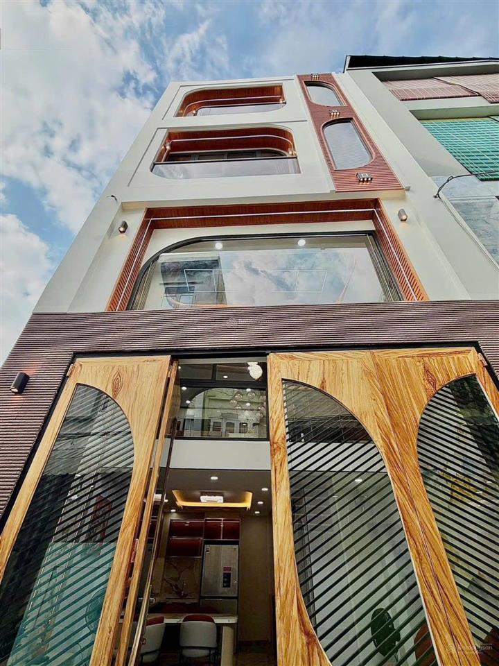 Sát bình thạnh nhà xây mới 5 tầng  lý thường kiệt  (4.7x9m) nở hậu 5m  hẻm ô tô  full nội thất