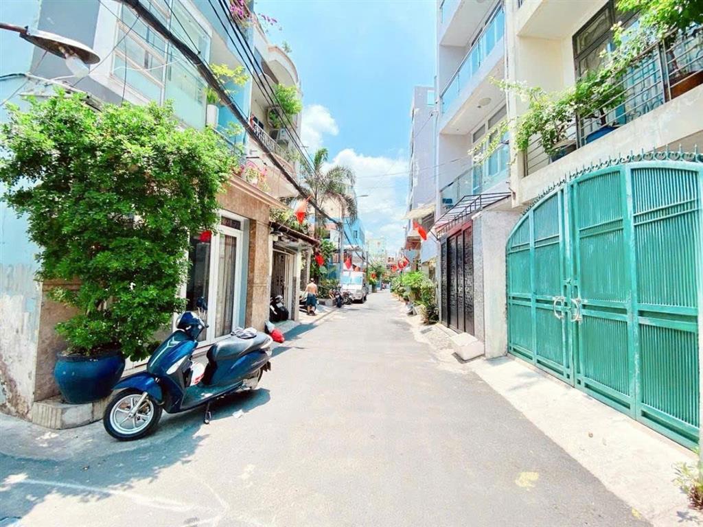 Hẻm ô tô đậu cửa thông rạch xuyên tâm bình thạnh, nhà 5 lầu mới ở ngay, kế chợ bà chiểu
