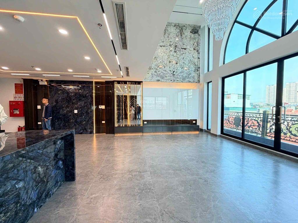 Bán tòa văn phòng kinh doanh  thông sàn mt rộng  kim đồng 98 m2, 7 tầng, giá 30 tỷ