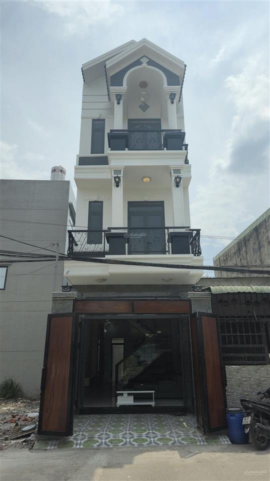 Nhà mới 1 trệt 2 lầu sân thượng cách mt lolu 15met