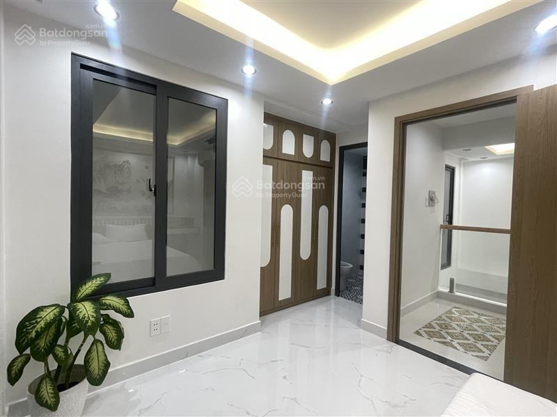 Xe hơi đỗ cửa nhà đẹp 6 tầng sát mặt tiề phan xích long 50m2 ngang 5m , kinh doanh được  9,3 tỉ tl