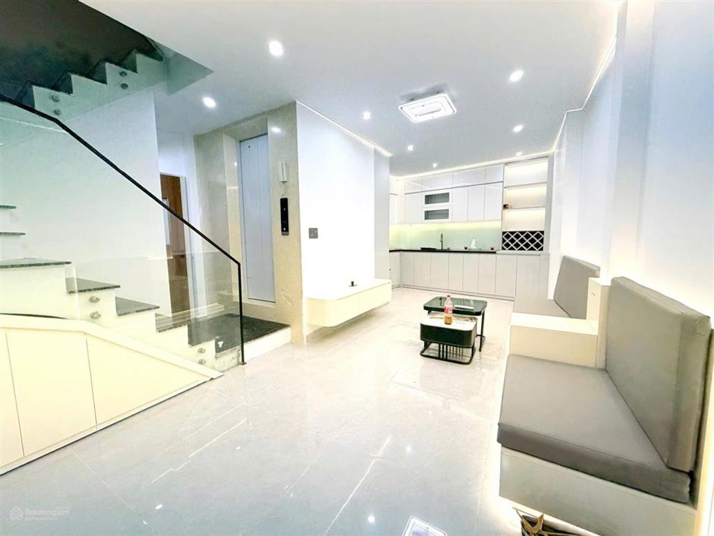 Hơn 12 tỷ  hoàng văn thái  55m  5 tầng thang máy  ô tô đỗ cổng, nhà đẹp, hiện đại, sổ đỏ nở hậu