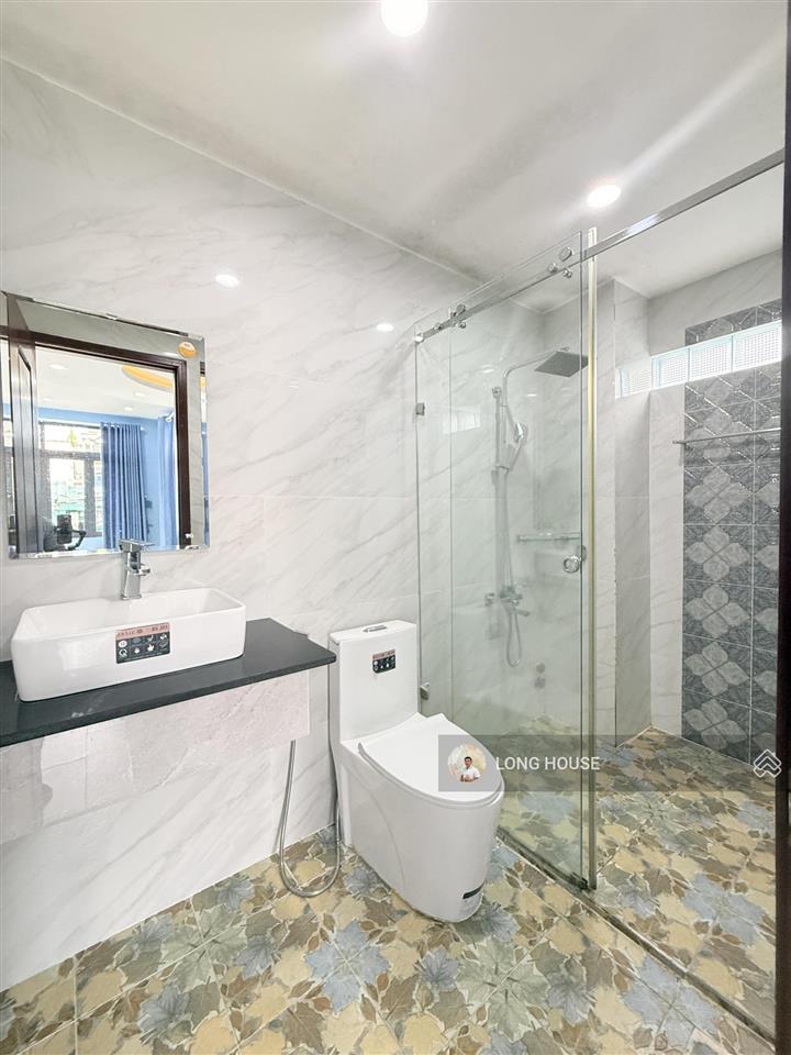 Nhà 4 tầng cách 1 căn ra mặt tiền lê quang định  hẻm trước nhà 4m, sổ nở hậu tài lộc