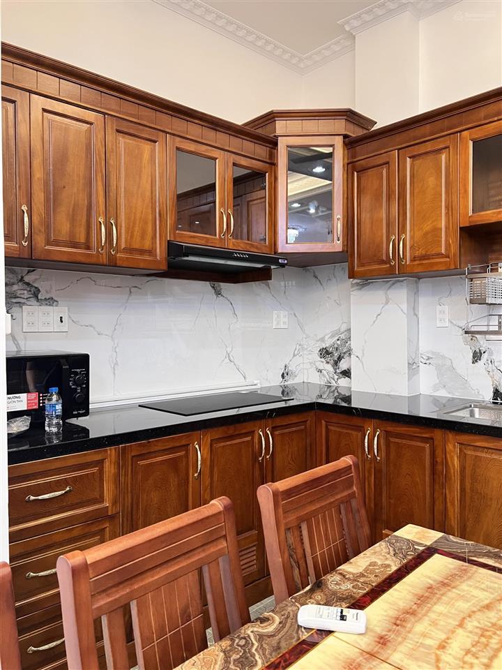 Bán nhà mt gần trường trần huy liệu, 6,5m x 8m vuông đẹp 5 tầng, thang máy chỉ 15,5 tỷ
