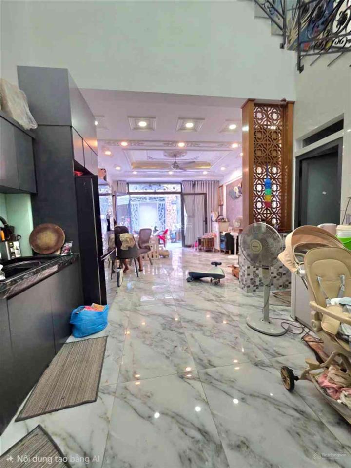Nhà 4 tầng hẻm xe hơi 6m  ngay chợ lê văn quới.