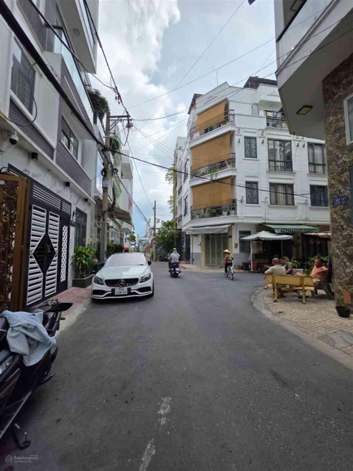 Nhà 4 tầng hẻm xe hơi 6m  ngay chợ lê văn quới.