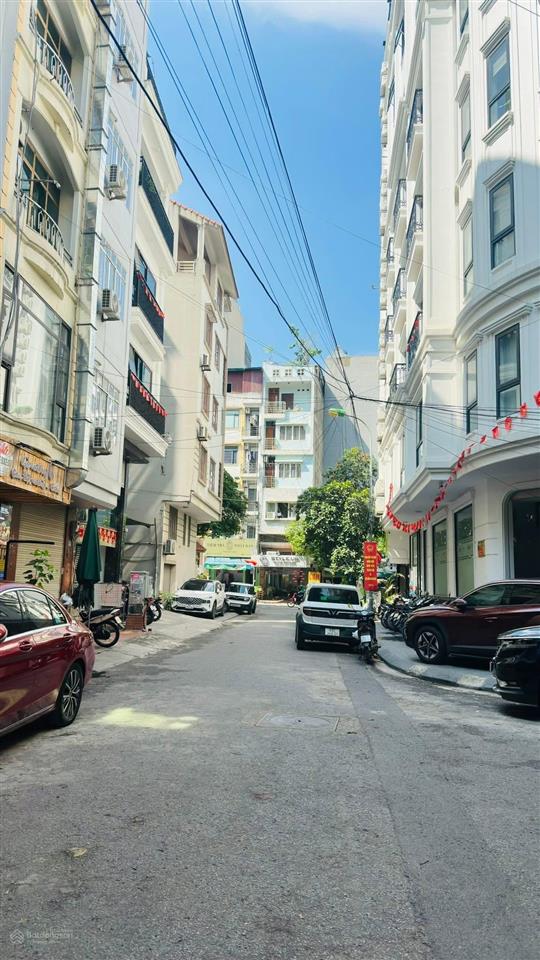 Bán tòa building dương khuê, dt 180m2 10t mt 24m lô góc đường 34ôtô tránh nhau