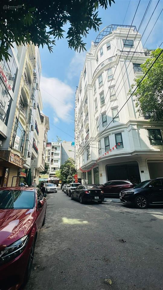 Bán tòa building dương khuê, dt 180m2 10t mt 24m lô góc đường 34ôtô tránh nhau