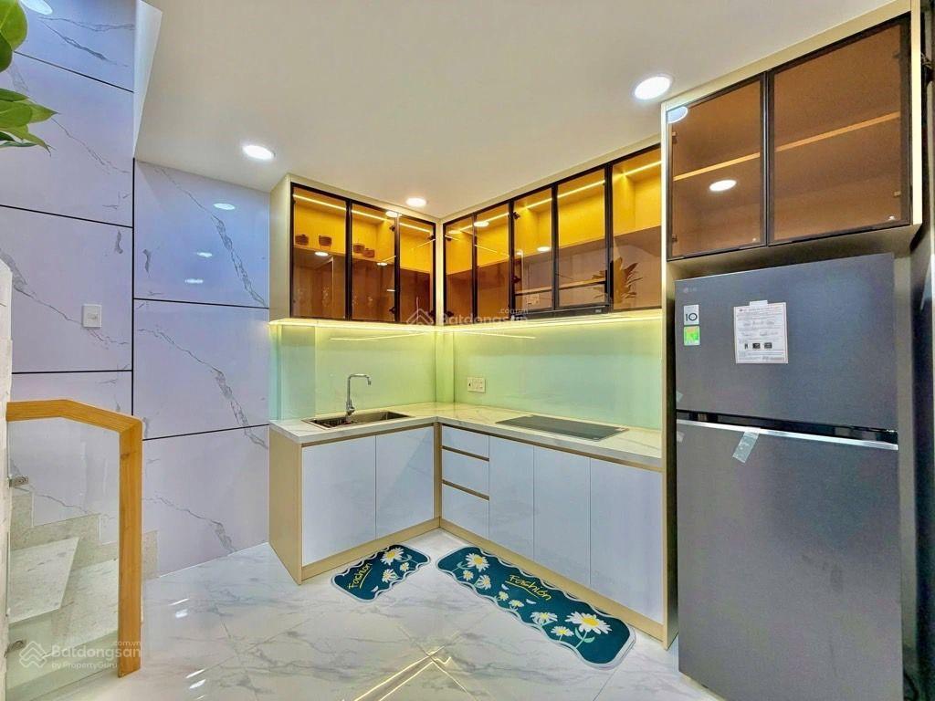 Sát mặt tiền lê quang định  4 tầng, 4 phòng ngủ, gần chợ bà chiểu, giá 7.4 tỷ