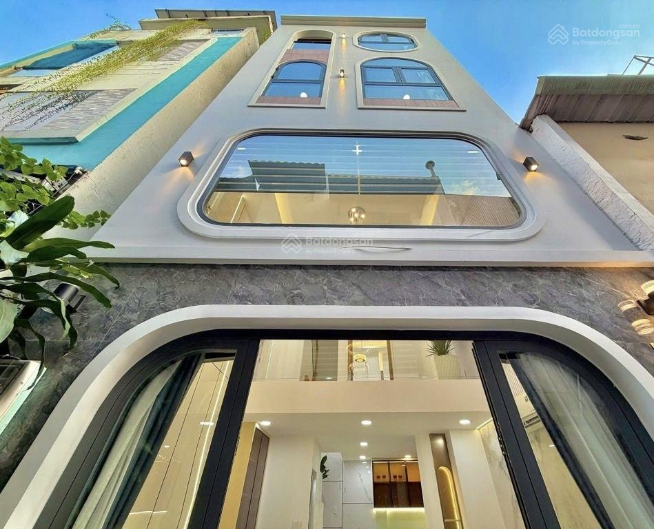 Sát mặt tiền lê quang định  4 tầng, 4 phòng ngủ, gần chợ bà chiểu, giá 7.4 tỷ