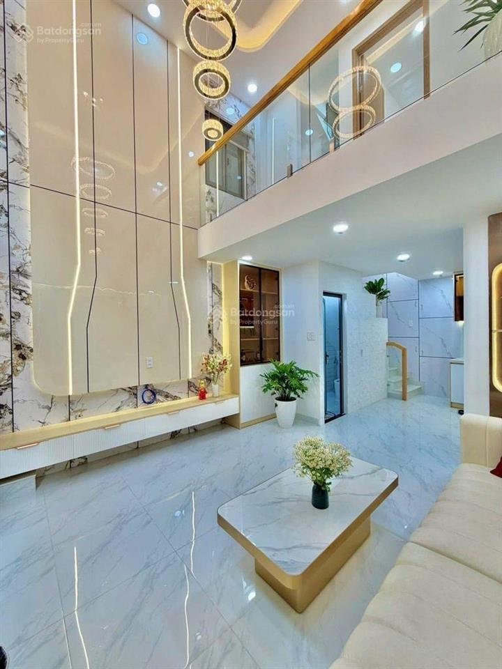 Sát mặt tiền lê quang định  4 tầng, 4 phòng ngủ, gần chợ bà chiểu, giá 7.4 tỷ