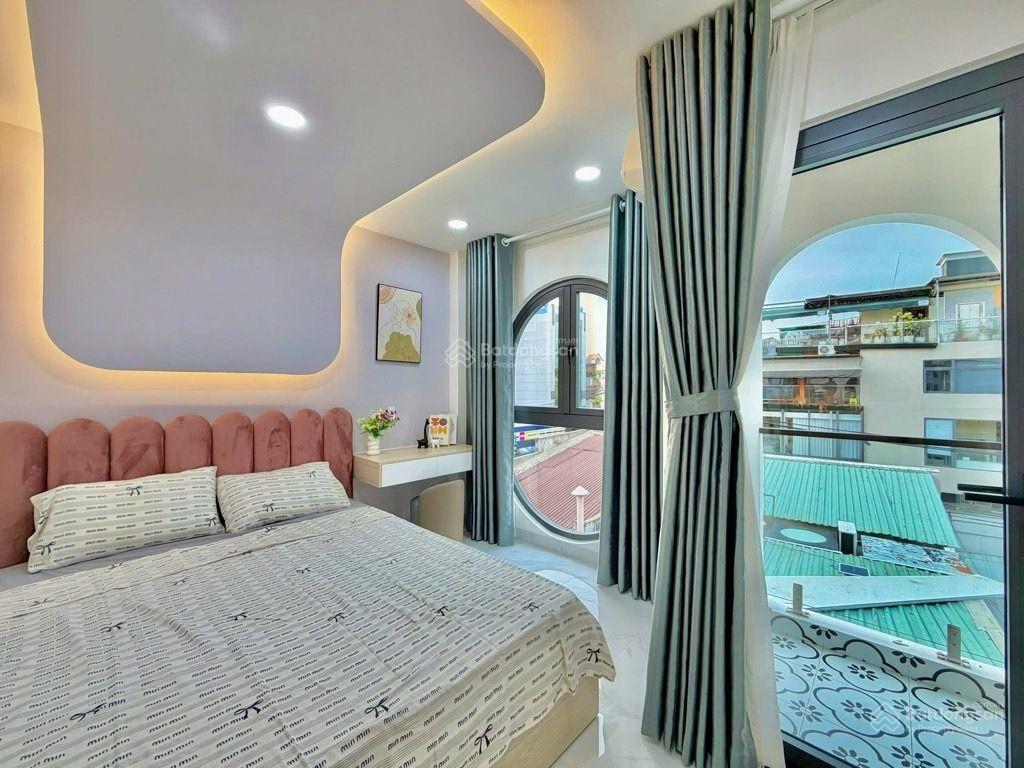 Sát mặt tiền lê quang định  4 tầng, 4 phòng ngủ, gần chợ bà chiểu, giá 7.4 tỷ