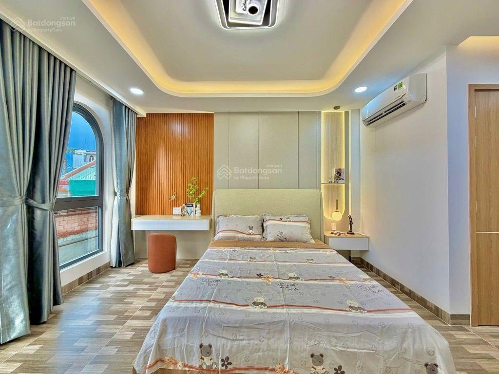 Sát mặt tiền lê quang định  4 tầng, 4 phòng ngủ, gần chợ bà chiểu, giá 7.4 tỷ