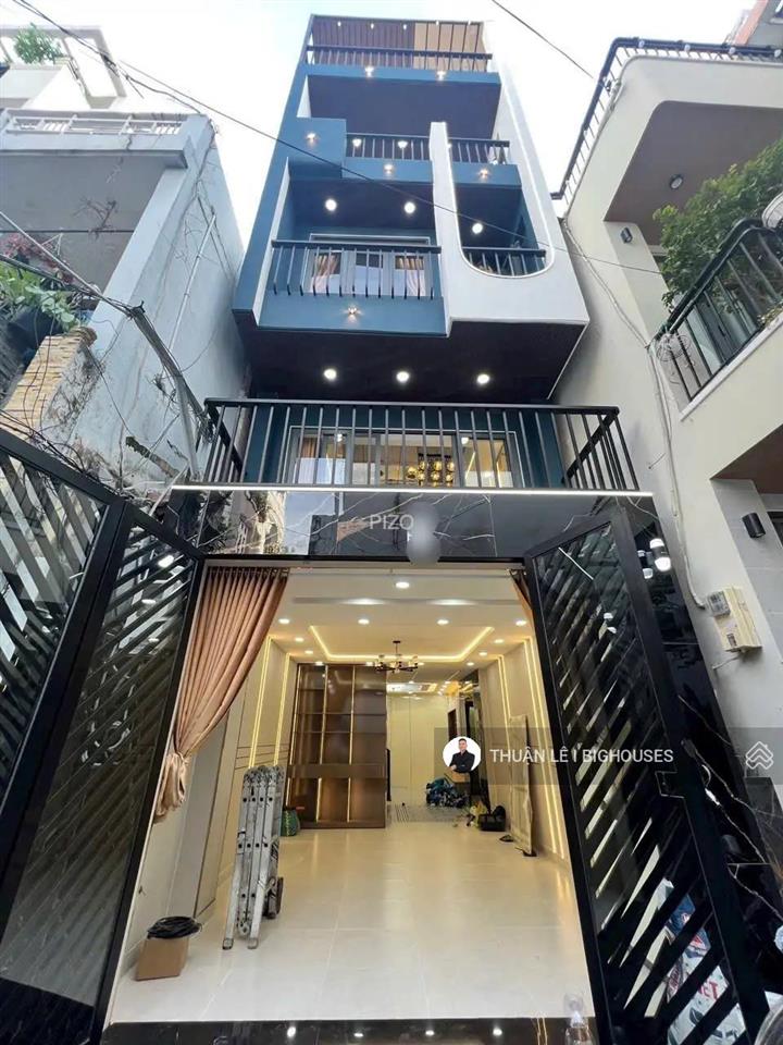 Bán nhà 4 tầng mới, đẹp thang máy khu phan đăng lưu & thích quảng đức (4mx13m) chủ hạ 2tỷ bán gấp