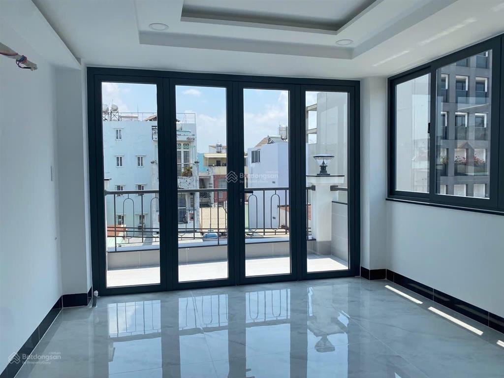 Bán nhà mtkd 4 tầng mới đẹp ngay nơ trang long  lê quang định, dts 200m2, 6pn, giảm còn 15.49 tỷ