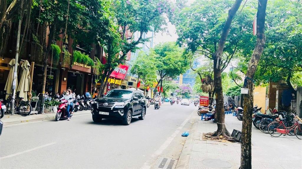Chủ giảm sâu 5 tỷ building 9t thang máy mặt phố chùa láng 140m2 , mt 6m, 110 tỷ có hầm, kinh doanh