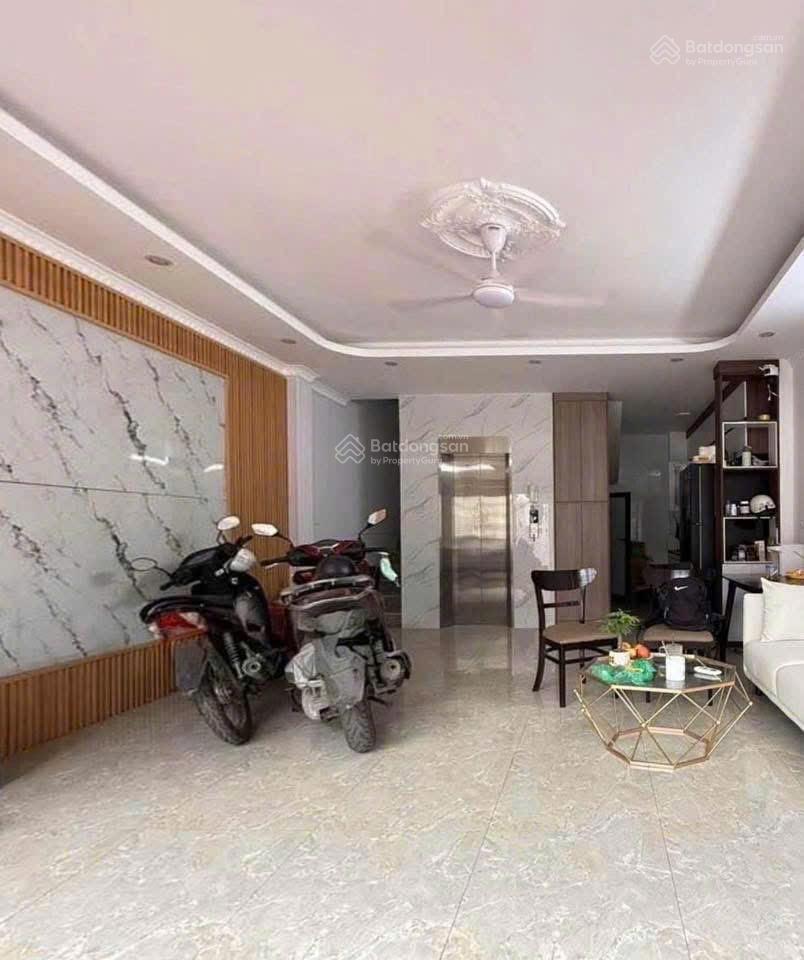9tỷ hơn  5 tầng thang máy mặt ngõ kinh doanh  ngõ thông oto.
