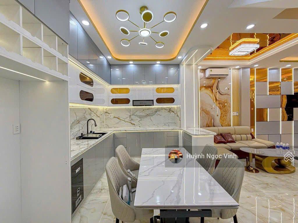 Nhà đường 8m gò ô môi sát phú mỹ hưng, 5x12m, 3 tầng full nội thất có gara ô tô, giá 9,899 tỷ