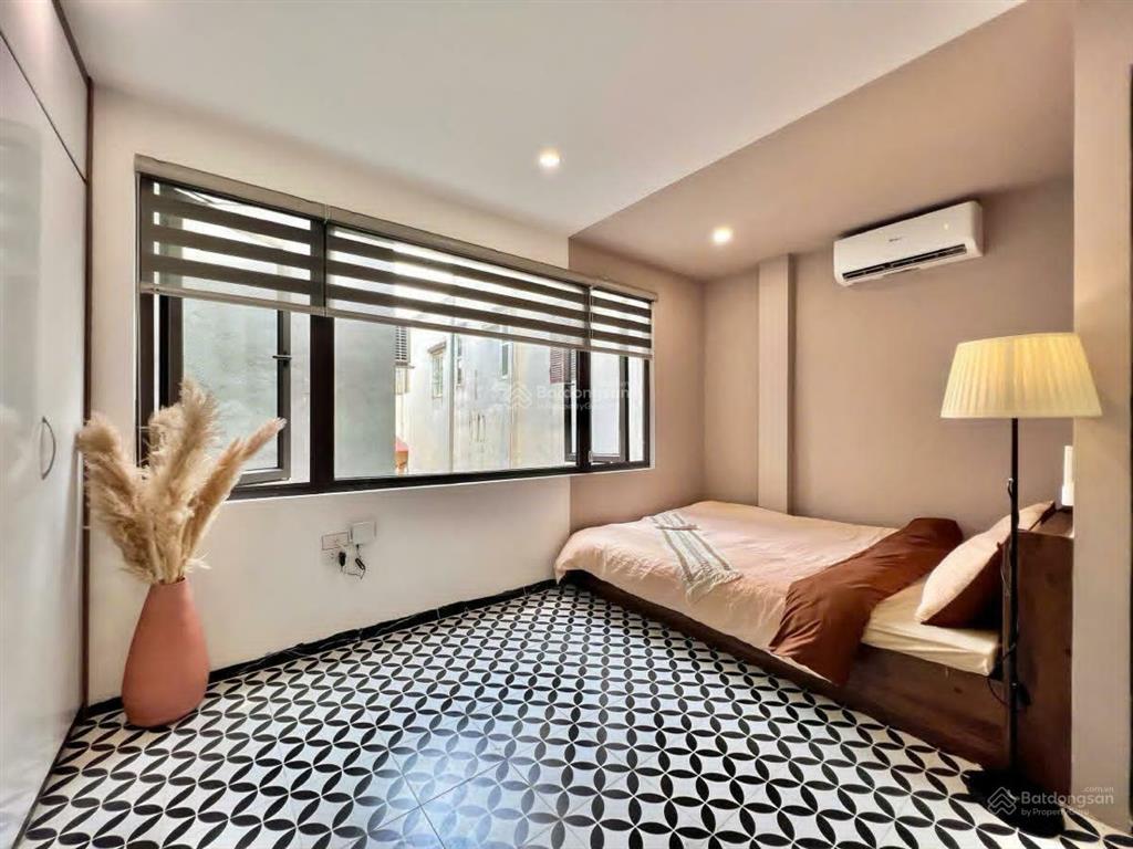 Dòng tiền siêu khủng 1 tỷ/n toà chdv hào nam 65m2*7t*12pkk, 50m ra phố, thang máy, pccc/gpxd