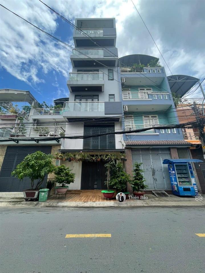 Bán nhà 525/quang trung (4x16m) 4 tầng lầu 4 phòng ngủ + đường nhựa 8m  xe hơi chạy song song