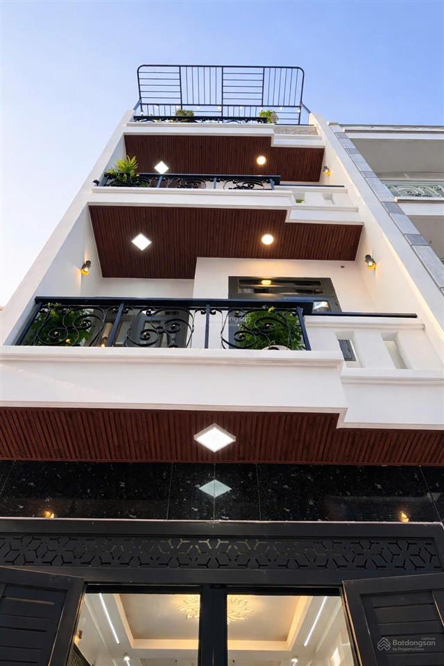 Nhà mới đẹp 4 tầng 4pn hẻm xe hơi 6m gần hương lộ 2. 6,5 tỷ