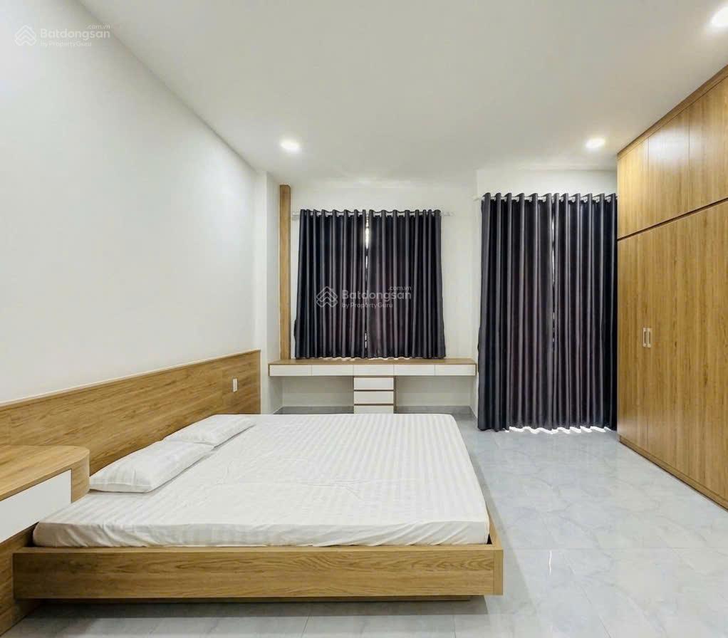 Gấp bán 39m2 x 4 tầng nhà đẹp, hẻm 2 xe hơi thông ra dương quảng hàm
